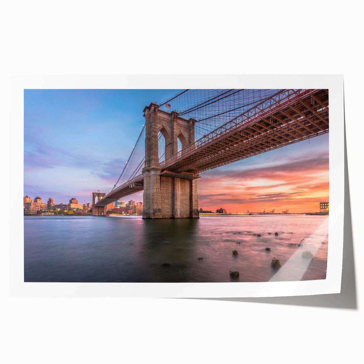 Rolled print of a serene landscape featuring a bridge over a tranquil river, designed for wall art decor. Ideal for enhancing home aesthetics with nature-inspired themes.