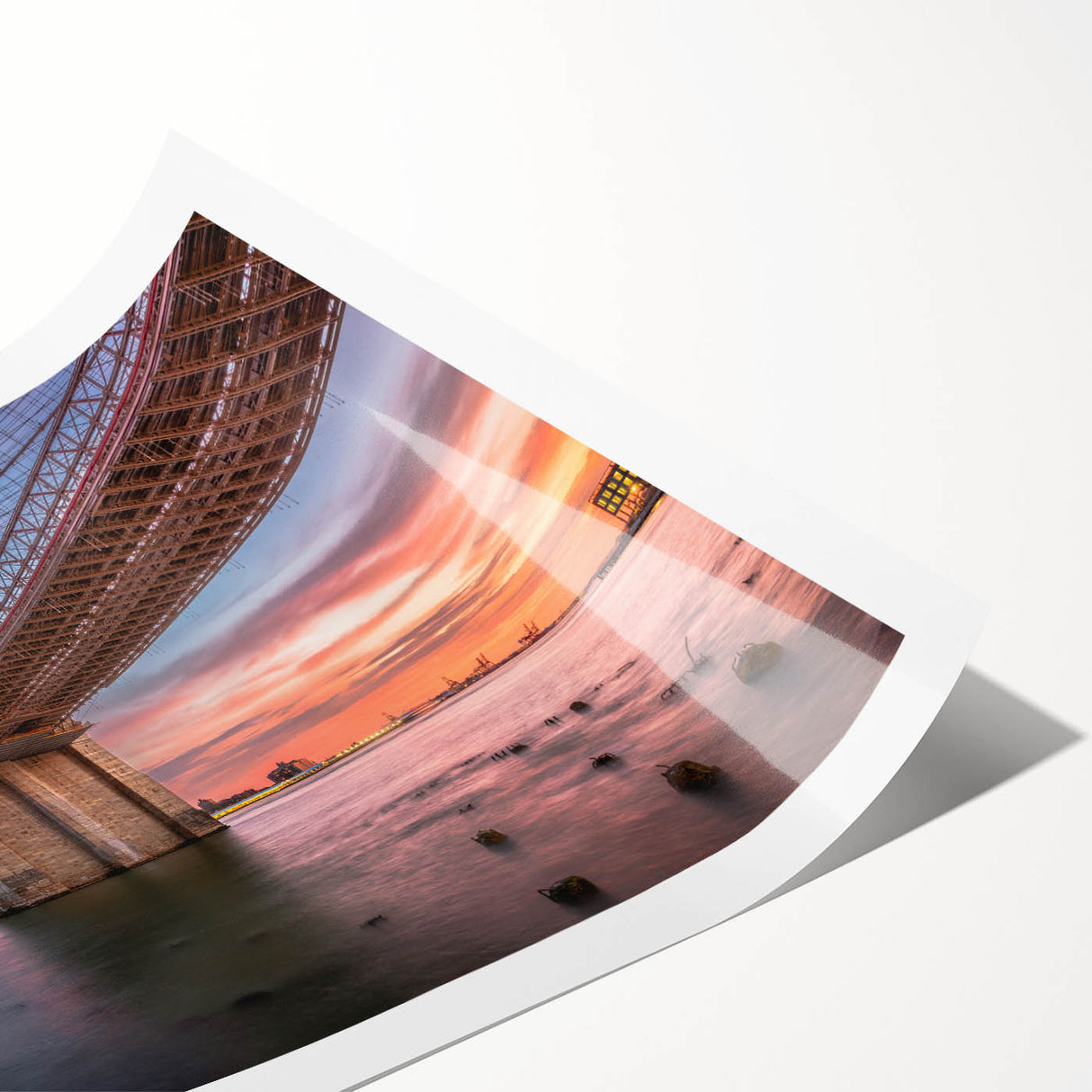 Vibrant rolled print showcasing a serene landscape bridge design, featuring lush greenery and a tranquil waterway, ideal for home decor or office art.