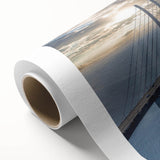 Rolled canvas art showcasing a serene landscape bridge design in vibrant colors, perfect for home decor, elegantly packaged in a protective tube for delivery.