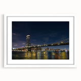 Framed landscape wall art showcasing a serene bridge over a river, featuring a white mat and sleek black frame, ideal for modern home décor.