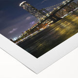 Rolled canvas artwork showcasing a serene landscape with a bridge over a river, featuring vibrant colors and intricate details, perfect for home decor.