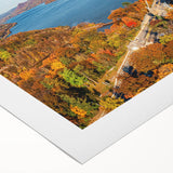 Rolled canvas artwork showcasing a vibrant landscape featuring a bridge over serene waters, perfect for home decor. The design emphasizes natural colors and textures.