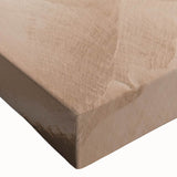 Close-up of a stretched canvas wall art piece featuring a vibrant landscape with a bridge, showcasing rich colors and intricate details, ideal for home decor.