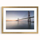 Framed wall art featuring a scenic landscape design with a bridge, elegantly presented with a gold mat, enhancing any decor and perfect for home or office settings.