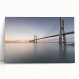 Stretched canvas wall art showcasing a vibrant landscape bridge design, featuring rich colors and intricate details, leaning against a neutral wall for display.