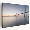 Stretched canvas wall art featuring a serene landscape with a wooden bridge, vibrant greenery, and soft blue skies, perfect for enhancing home decor and creating a tranquil atmosphere.