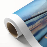 Rolled canvas wall art showcasing a serene landscape scene with a bridge over a tranquil river, perfect for home decor, featuring vibrant colors and detailed textures.