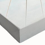 Close-up of a stretched canvas featuring a vibrant landscape design with a bridge, showcasing rich colors and intricate details, perfect for home decor.