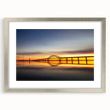 Elegant silver-framed landscape wall art featuring a serene bridge design, perfect for enhancing home decor. The piece includes a mat for added sophistication.
