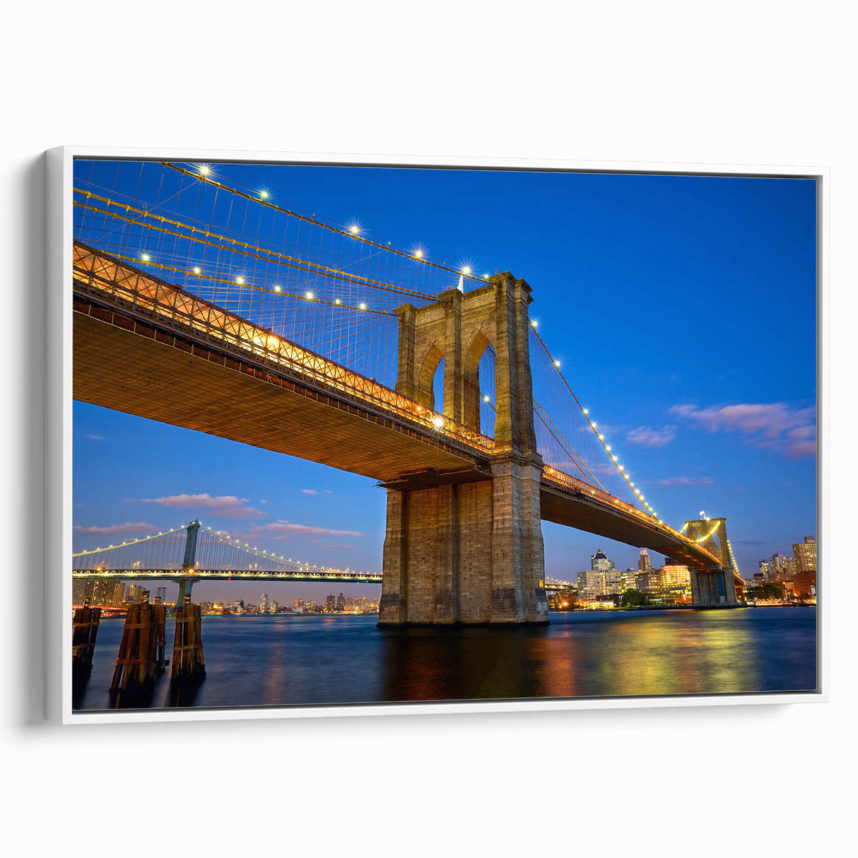 Framed canvas wall art featuring a stunning landscape with a bridge, showcasing vibrant colors and intricate details, perfect for home decor. The white frame adds a modern touch, enhancing the overall aesthetic appeal of the artwork.