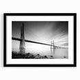 Framed wall art featuring a picturesque landscape with a bridge, presented in a sleek black frame and matting, ideal for enhancing home decor aesthetics.