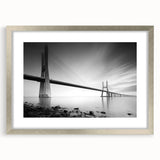 Framed wall art collection showcasing a serene landscape with a modern bridge design, featuring a silver frame and mat, ideal for contemporary home decor.
