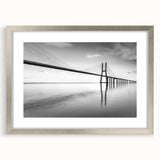 Framed wall art featuring a silver mat showcasing a scenic landscape bridge design, perfect for home decor, adding elegance and charm to any room.
