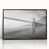 Framed acrylic wall art showcasing a modern landscape featuring a bridge against a serene backdrop, designed with a sleek black frame, perfect for contemporary home decor.