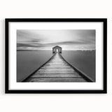 Framed wall art featuring a black mat and a scenic landscape bridge design, showcasing vibrant colors and intricate details, ideal for home decor enhancement.