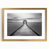 Gold-framed wall art featuring a serene landscape with a bridge, showcasing vibrant colors and intricate details, perfect for home decor and interior design.