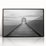 Framed acrylic wall art showcasing a modern landscape design featuring a bridge, presented in sleek black framing, ideal for contemporary home decor.