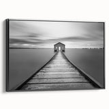 Framed canvas wall art showcasing a scenic landscape with a bridge, featuring a black frame and side view, ideal for modern home decor. Perfect for enhancing living spaces with artistic flair.