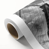 Rolled canvas print showcasing a serene landscape bridge design with vibrant colors and intricate details, ideal for enhancing home decor. Packaged securely for delivery.