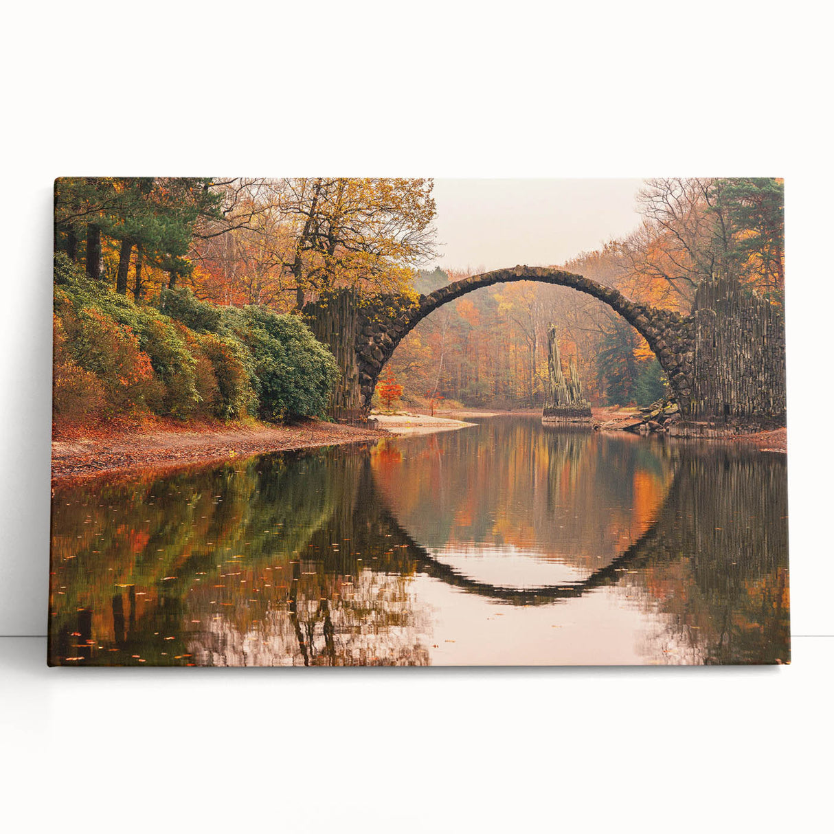 Stretched canvas wall art showcasing a vibrant landscape with a bridge, perfect for home decor. The design features bold colors and intricate details, enhancing any interior space. Ideal for nature enthusiasts and art lovers alike, this piece adds a touch of tranquility and elegance to your walls.