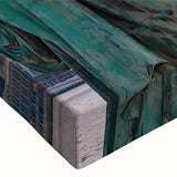 Close-up of a stretched canvas showcasing a vibrant landscape and bridge design, featuring rich colors and intricate details, ideal for modern home decor.