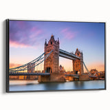 Framed wall art of a serene landscape featuring a bridge over a tranquil river, presented in a sleek black frame, ideal for modern home decor. The artwork captures vibrant colors and detailed scenery, enhancing any interior space with an elegant touch.