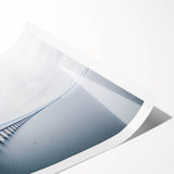 Rolled print showcasing a vibrant landscape bridge design in warm hues, perfect for home decor; packaged securely in a protective cardboard tube.