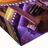 Close-up of a vibrant stretched canvas showcasing a beautifully designed landscape bridge scene, featuring lush greenery and a serene waterway, perfect for home decor.