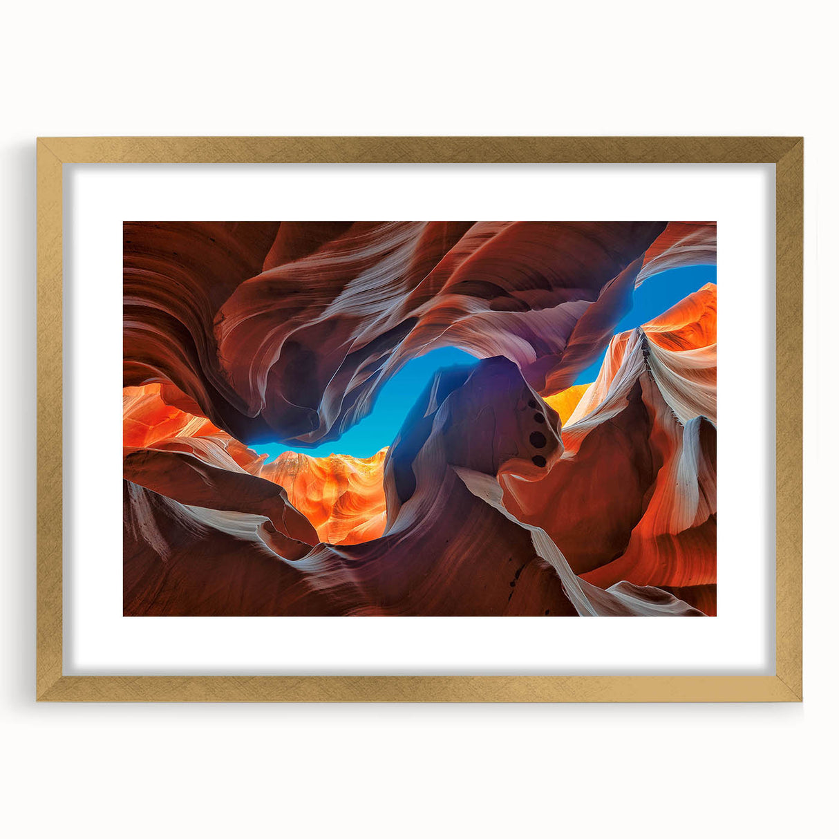 Framed wall art featuring a stunning canyon landscape design with a gold mat and frame. Ideal for enhancing home décor with a touch of nature's beauty.