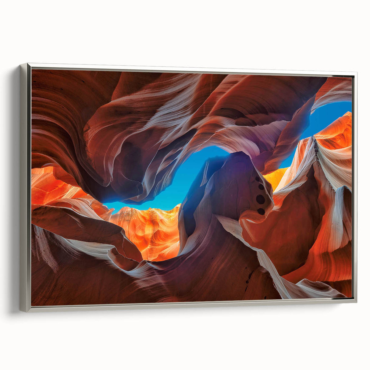 Framed canvas wall art showcasing a stunning canyon landscape design with vibrant colors and intricate details, elegantly displayed in a silver frame, perfect for home decor.