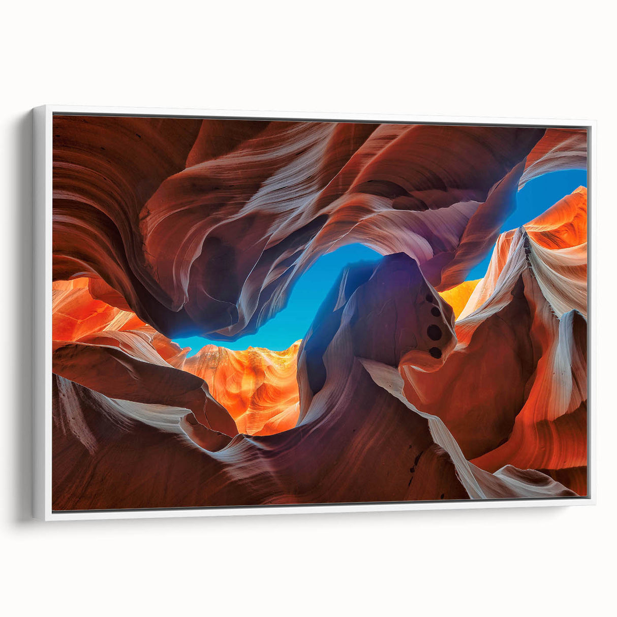 Framed canvas wall art showcasing a stunning canyon landscape design, with vibrant colors and intricate details, presented in a sleek white frame for modern decor.