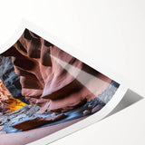 Vibrant rolled print of a canyon landscape showcasing rich earth tones and dramatic rock formations, ideal for enhancing home decor with natural beauty.