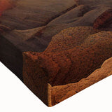 Close-up of a stretched canvas wall art piece depicting a vibrant canyon landscape, showcasing rich colors and intricate textures, perfect for home decor.