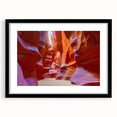 Framed wall art featuring a stunning canyon landscape design, showcasing vibrant colors and intricate details, set in a sleek black frame with matting, ideal for home decor.