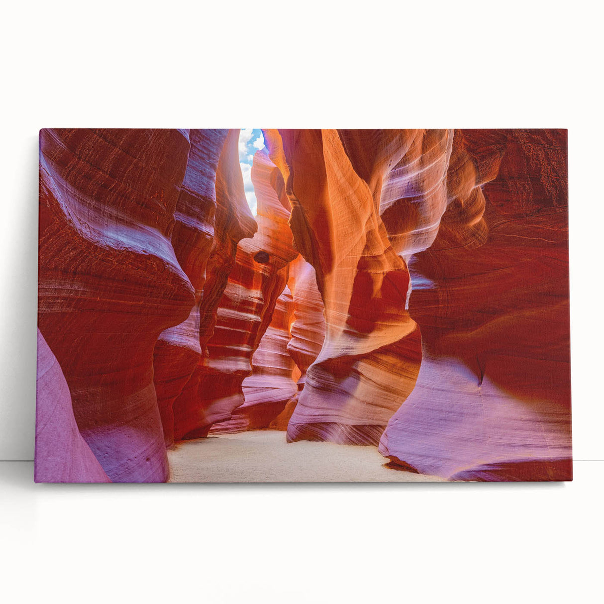 Stretched canvas wall art showcasing a vibrant landscape of canyons, featuring rich earthy tones and dramatic rock formations, perfect for home décor.