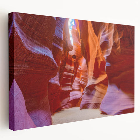 Stretched canvas wall art showcasing a vibrant canyon landscape design in warm hues, perfect for home decor; side view highlighting texture and depth.