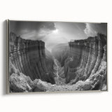 Framed canvas wall art featuring a stunning canyon landscape design in rich earthy tones, displayed from a side view with a sleek silver frame, perfect for home decor.