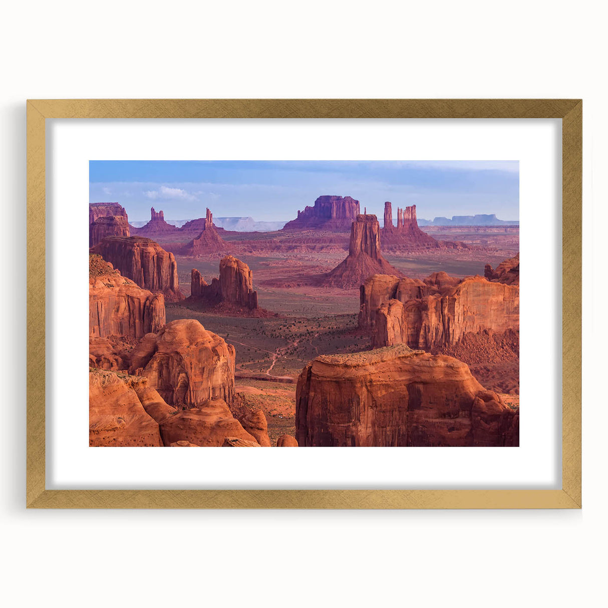 Framed wall art featuring a stunning landscape of canyons, with a gold frame and matting, showcasing vibrant colors and intricate details, ideal for home decor.