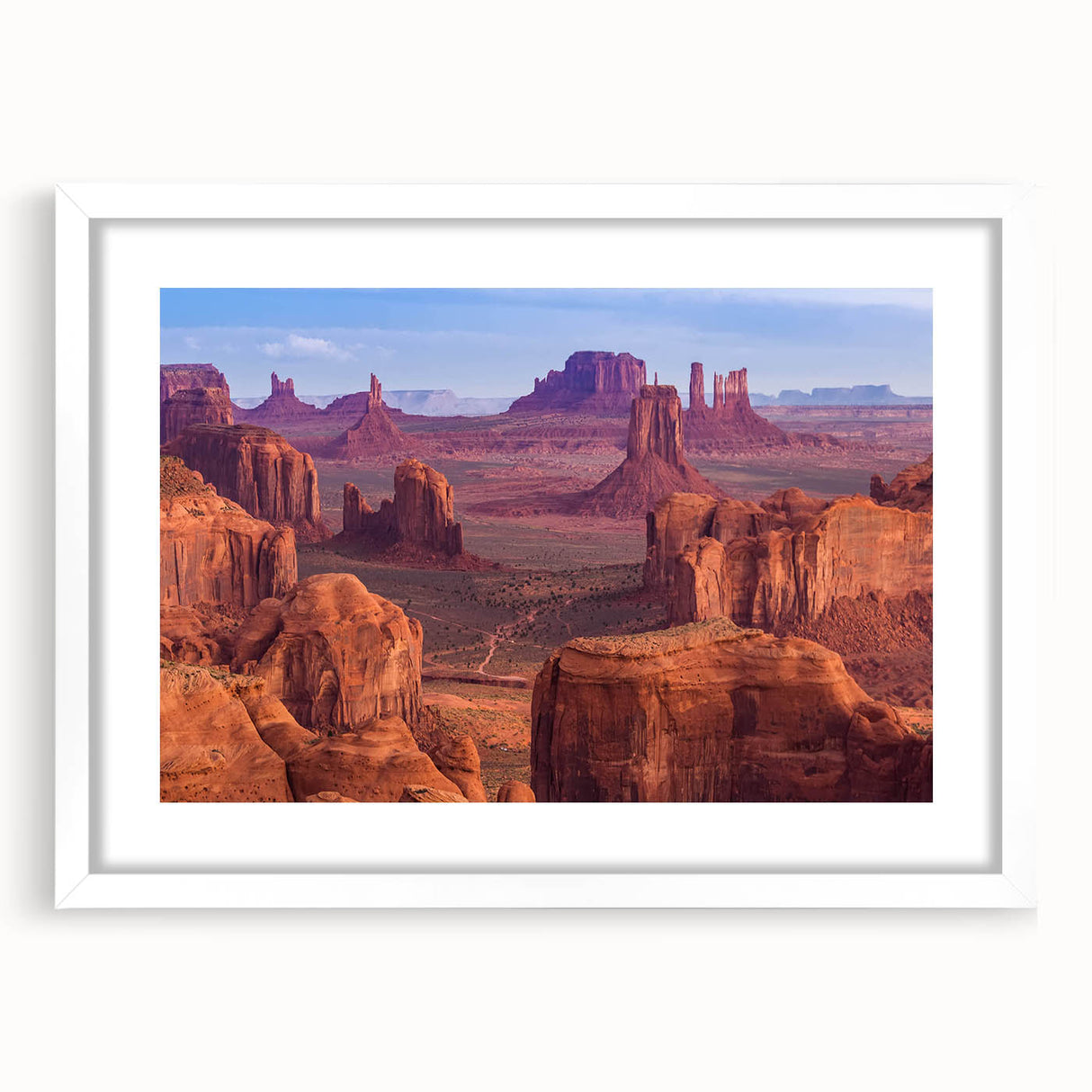 Framed wall art featuring a stunning canyon landscape design, displayed in a sleek white mat, ideal for enhancing home decor with natural beauty.