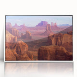 Framed acrylic wall art featuring a stunning canyon landscape design with vibrant colors, showcasing intricate details and a sleek white frame, perfect for home decor.