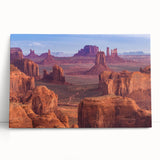 Stretched canvas wall art showcasing a vibrant canyon landscape design, leaning against a textured wall, perfect for home decor and nature enthusiasts.