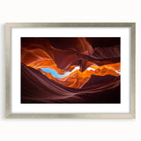 Framed wall art featuring a stunning landscape of canyons, with a silver mat and sleek frame, perfect for home decor or office settings, adds elegance to any space.