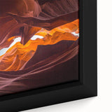 Close-up of a framed canvas wall art piece showcasing a vibrant canyon landscape with rich colors and intricate details, perfect for modern home decor.