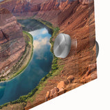 Close-up of an acrylic glass wall art piece depicting a vibrant canyon landscape, showcasing rich colors and intricate details, ideal for modern decor.