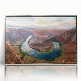 Framed wall art showcasing a stunning canyon landscape with rich colors and intricate details, featuring a sleek silver frame, ideal for modern home decor.