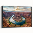 Framed canvas wall art showcasing a vibrant canyon landscape design with rich earth tones, black frame, and a side view that highlights its depth and texture. Perfect for adding a natural touch to modern home decor.