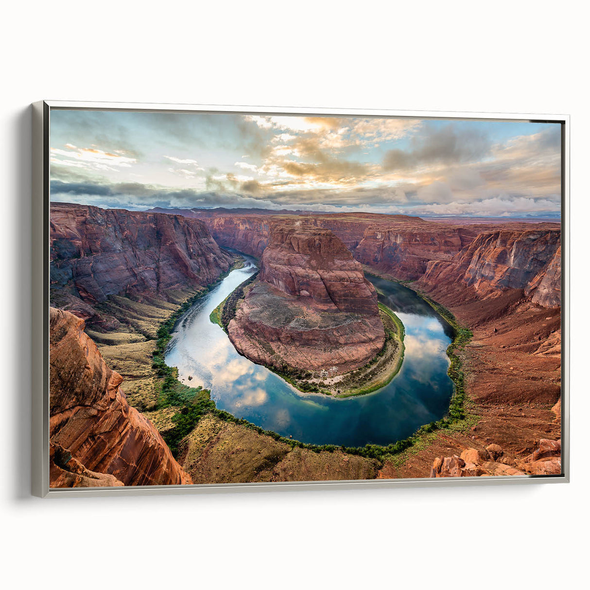Framed canvas artwork showcasing a stunning canyon landscape with vibrant colors, silver frame, and side view details, perfect for home decor enthusiasts.