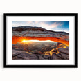 Framed landscape wall art depicting vibrant canyon scenery in rich earthy tones, featuring a sleek black frame with a white mat, perfect for home decor.