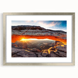 Framed wall art featuring a stunning canyon landscape design, set in a silver frame with a mat. Ideal for enhancing home decor with natural beauty and vibrant colors.