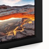 Close-up of a framed canvas art piece showcasing a vibrant canyon landscape design with rich colors and intricate details, perfect for home decor.